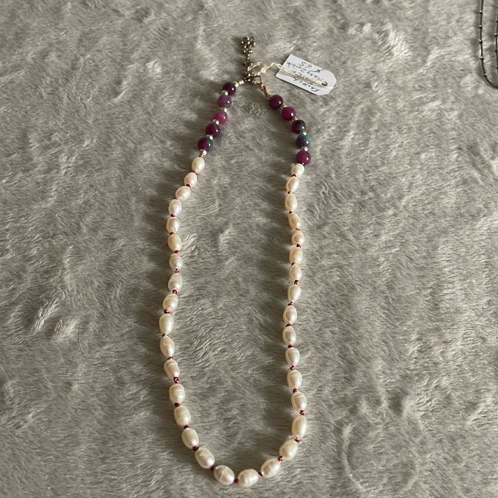 Hand knotted pearl and gemstone necklace.